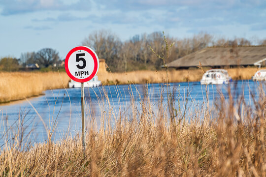5mph speed limit  among the reeds on the bank of the River Thurne in the Norfolk Broads