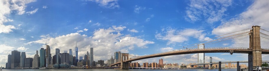 A beautiful panoramic photo of New York city skyline on sunshine day with beautiful blue clear sky.