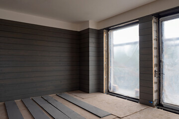 Wall cladding wood. Room is being renovated. Walls of apartment or office are faced with wood....
