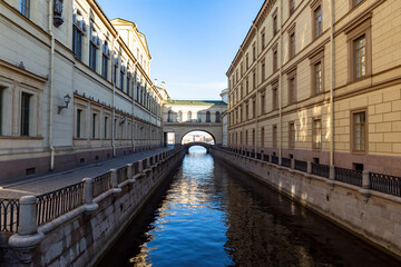 Canals of Saint Petersburg. Architecture of Russian cities. Canal between buildings in Saint Petersburg. Buildings of Petersburg on background sky. Exteriors of buildings in Russia.