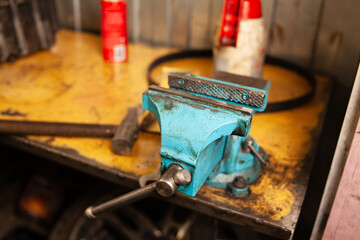 Garage workplace with blue handy bench vise 