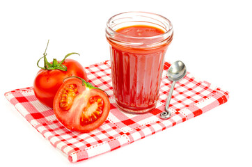 Glass of natural tomato juice, fresh red tomatoes on white background.