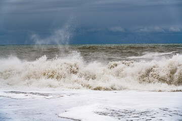 sea waves during a storm on a blue sky