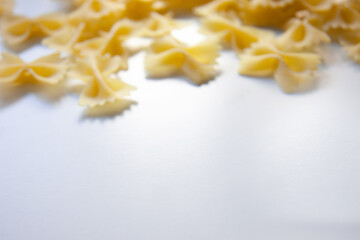 Blurred background farfalle pasta on a white table