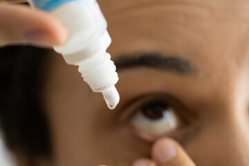 African Woman Pouring Eye Drop Medication For Glaucoma