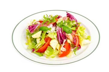 Plate with lettuce, tomatoes, olive oil. Vegetarian menu.