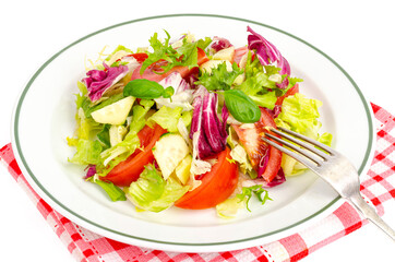 Plate with lettuce, tomatoes, olive oil. Vegetarian menu.