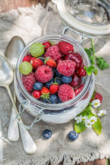 Muesli with flowers and fruits. Healthy breakfast.