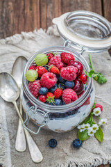 Healthy breakfast. Muesli with flowers and fruits.