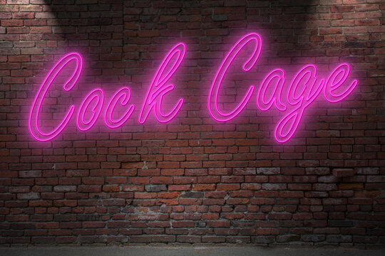 Neon Cock Cage lettering on Brick Wall at night