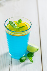 Blue cocktail with citrus. Healthy and varied diet.