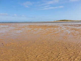 Long beach with blue sky