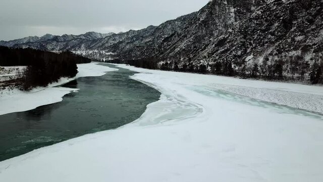 Mountain river in winter from a height