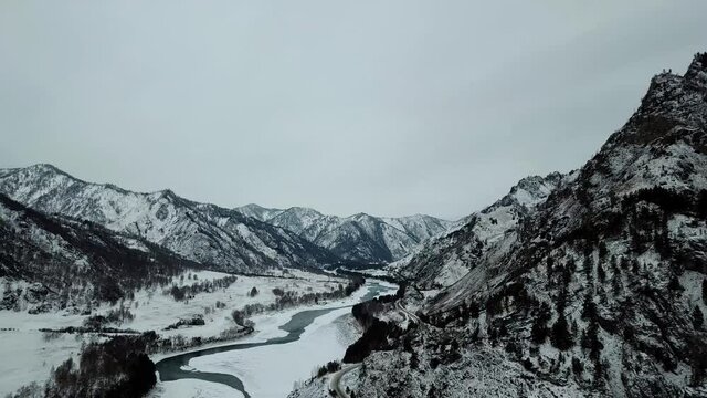 Mountain river in winter from a height