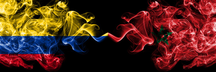 Colombia, Colombian vs Morocco, Moroccan smoky mystic flags placed side by side. Thick colored silky abstract smokes flags.