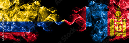 Colombia, Colombian vs Mongolia, Mongolian smoky mystic flags placed side by side. Thick colored silky abstract smokes flags.