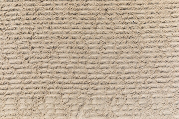 Texture of white sand on the beach.