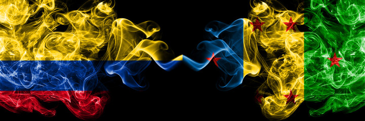 Colombia, Colombian vs Ogoni people smoky mystic flags placed side by side. Thick colored silky abstract smokes flags.