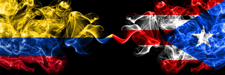 Colombia, Colombian vs Puerto Rico smoky mystic flags placed side by side. Thick colored silky abstract smokes flags.