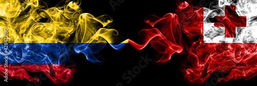 Colombia, Colombian vs Tonga smoky mystic flags placed side by side. Thick colored silky abstract smokes flags.
