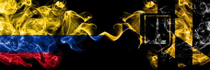 Colombia, Colombian vs United States of America, America, US, USA, American, Baltimore, Maryland smoky mystic flags placed side by side. Thick colored silky abstract smokes flags.