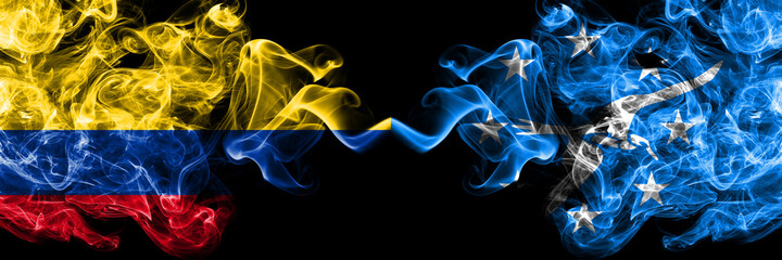 Colombia, Colombian vs United States of America, America, US, USA, American, Corpus Christi, Texas smoky mystic flags placed side by side. Thick colored silky abstract smokes flags.