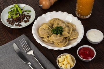 Dumplings with ketchup and sour cream