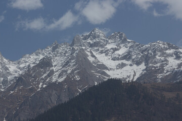 Fototapeta na wymiar Snow Mountains in the Himalayan Range near Himachal Pradesh