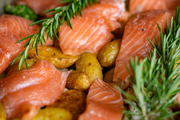 fresh salmon fish with potatoes and rosemary