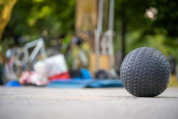 Closeup of a Slamball on the ground in a park with a blurry background