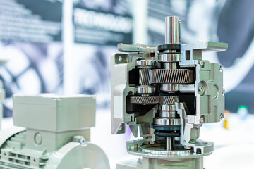 Cross section show metal cogs helical gear bearing housing shaft and other detail inside of  transmissions gearbox for industrial
