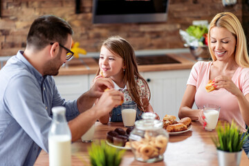 Family have breakfast in their kitchen