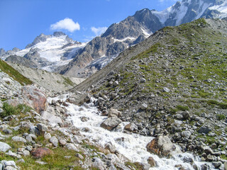 Fototapeta na wymiar Mountain stream on a summer day, caucasus mountains