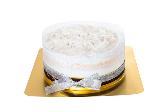 The coconut cake with coconut meat layer on topping isolated on white background..Homemade coconut fresh cream cake with bow ribbon decorate, Thai dessert..1 pound of Coconut fresh & white cream cake.