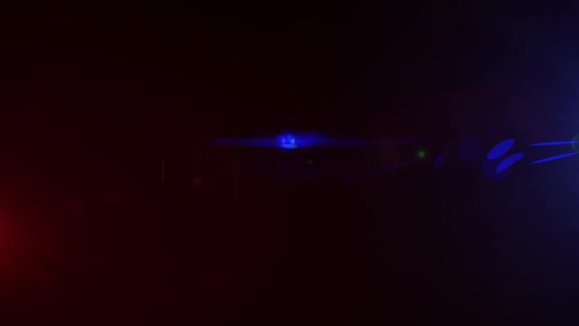 Red and Blue Lights Police Beacon isolated on a black background. Light leaks Glowing in 4K 60FPS seamless loop. Ambulance Emergency flashing light. Optical Lens Flare Effect.