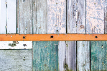 weathered old wooden wall design with faded paint