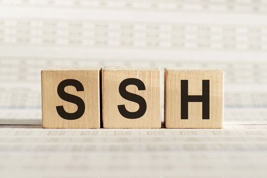 The Word SSH Formed By Wooden Blocks On A White Table