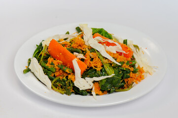 Urap (Indonesia Traditional Food). Urap is a salad dish of steamed vegetables mixed with seasoned and spiced grated coconut for dressing
