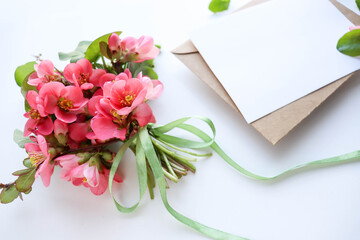 postcard layout. small bouquet of spring flowers on white background and space for text 