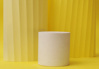 Podium in yellow color with geometric shapes. Stage with concrete, plaster geometric geometric shapes.