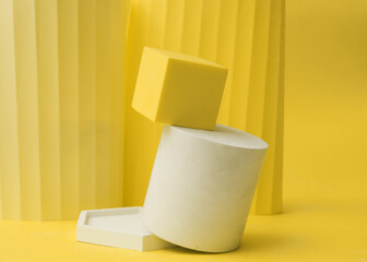 Podium in yellow color with geometric shapes. Stage with concrete, plaster geometric geometric shapes.