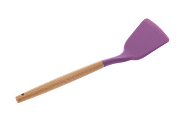 Kitchen tool in the form of a spatula made of lilac plastmass with a wooden handle for cooking