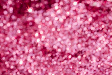 A pink abstract background made of defocused bokeh balls