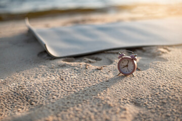 gray yoga mat on the beach. healthy lifestyle concept