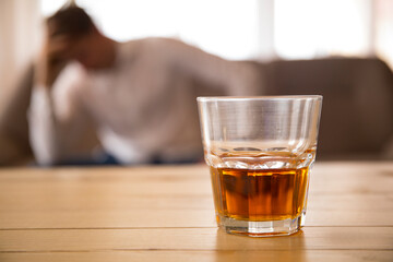 glass of whiskey. Wooden table. Problem alcohol. Drink. 