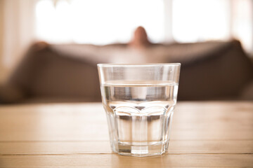 glass of water on the table. Man water glass. 