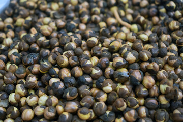 Closeup shot of fried chickpeas displayed in a market place