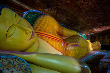 Mulkirigala, Sri Lanka, Asia, 02.07.2014: statue of reclining Buddha inside the caves of the Mulkirigala temple