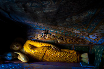 Mulkirigala, Sri Lanka, Asia, 02.07.2014: statue of reclining Buddha inside the caves of the Mulkirigala temple