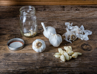 Peeling Fresh Garlic Bulbs - 428494360
